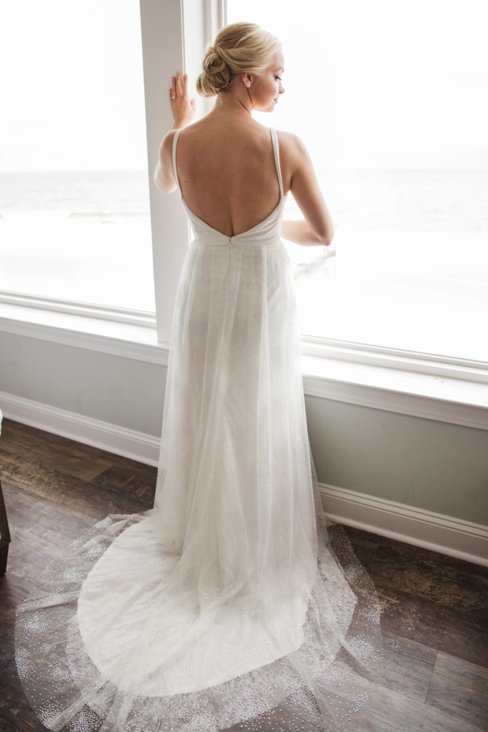 bride looking outside window 