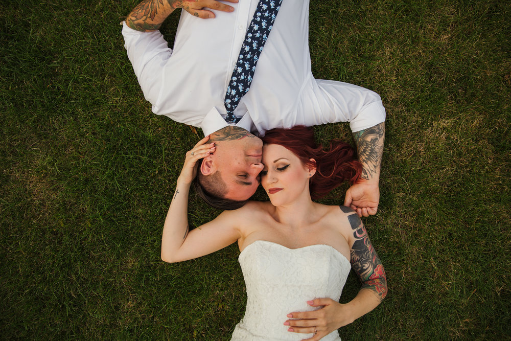 bride and groom laying down celebrating recent knoxville elopement