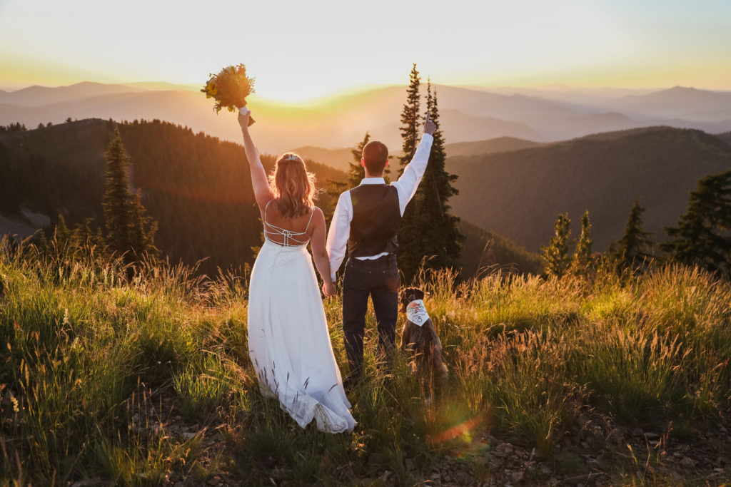 bride and groom celebrating mountain top elopement at sunset 