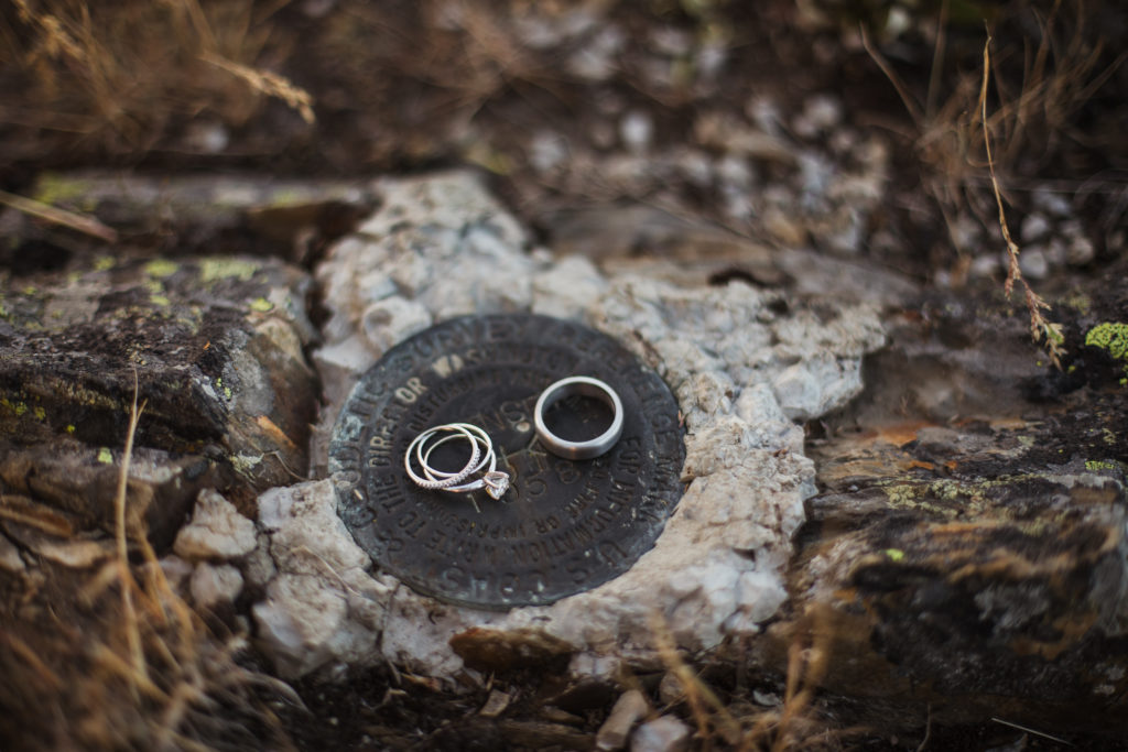 wedding ring detail shots on ground in mountain top elopement