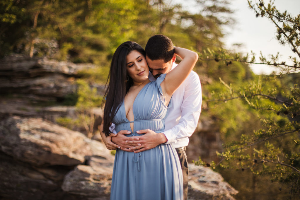 newly engaged couple embracing during engagement session