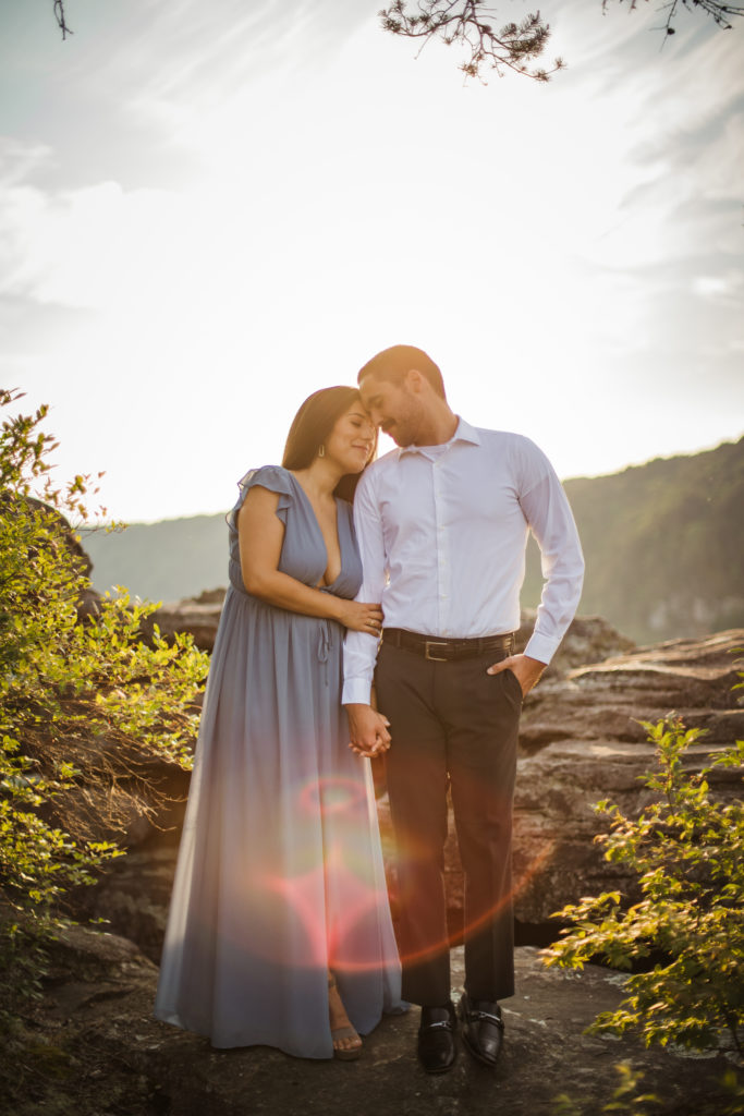 woman holding man's arm during fall creek falls engagement session