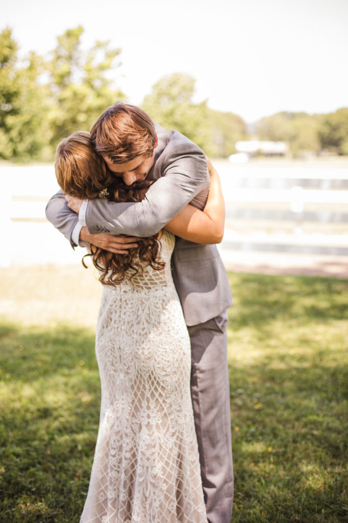 bride and groom hugging on wedding day in Knoxville Tennessee