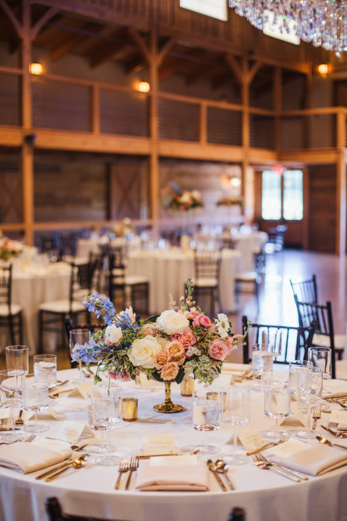 barn at sycamore farms ballroom with tables and floral centerpieces
