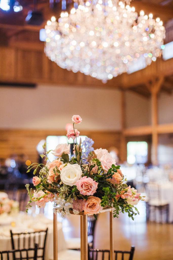 reception at barn at sycamore farms wedding with beautiful rose centerpieces 