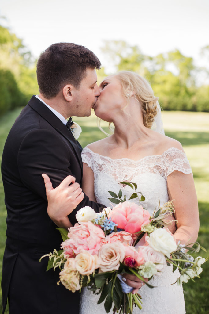 bride and groom kissing during bridals