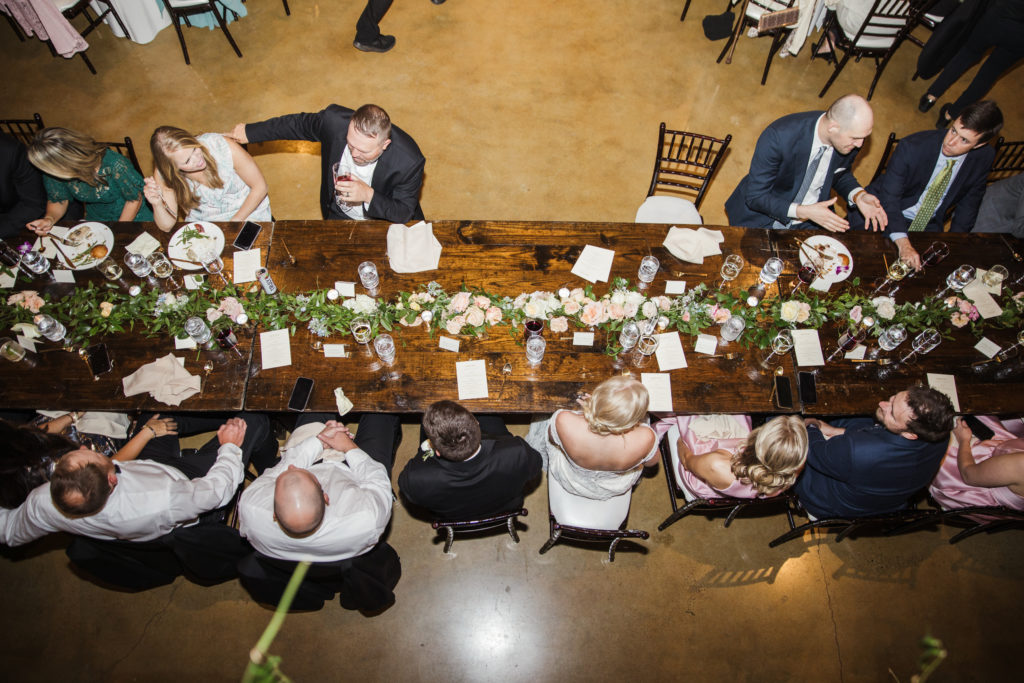 bridal party sitting at table during reception at barn at sycamore farms wedding