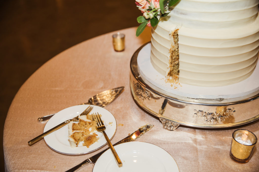 detail shot of first slice of wedding cake at barn at sycamore farms wedding