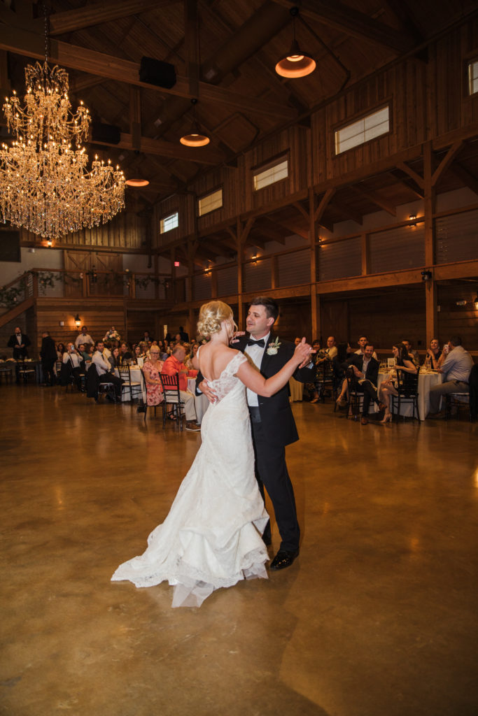 bride and groom dancing during first dance at barn at sycamore farms wedding reception