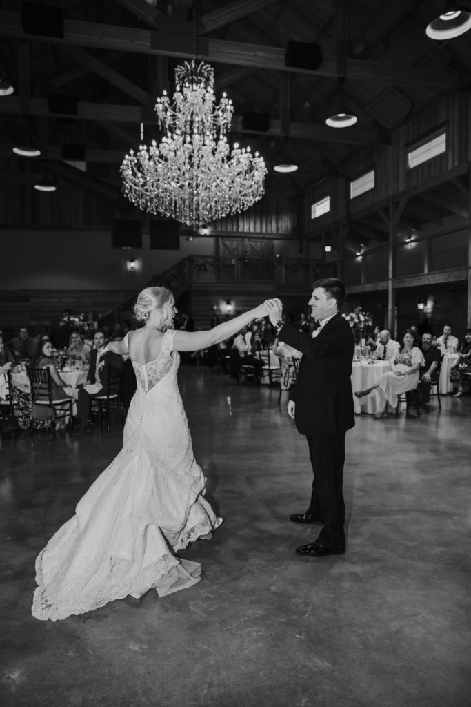 couple dancing during first look at barn at sycamore farms wedding