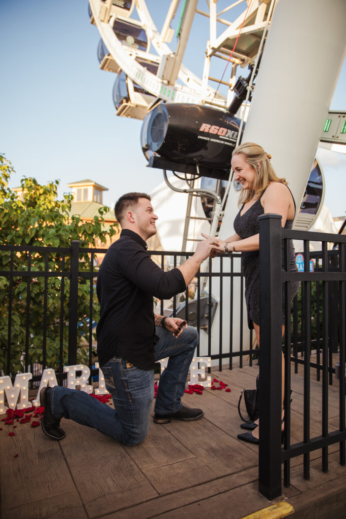 man getting down on one knee to propose at the Island of Pigeon Forge 