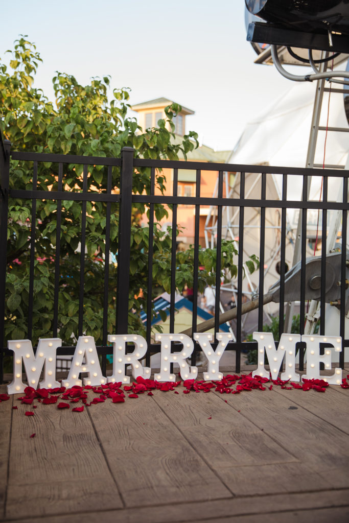 marry me sign in marque letters at the island in pigeon forge tennessee during surprise proposal