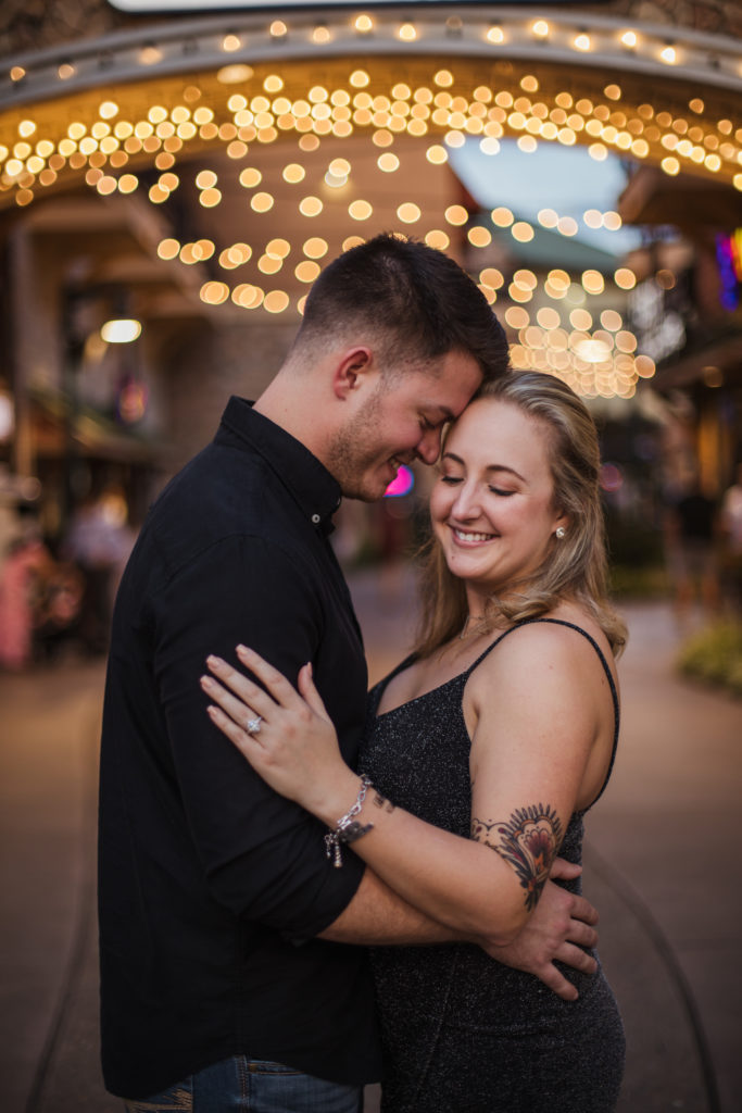 newly engaged couple celebrating together at the island of pigeon forge