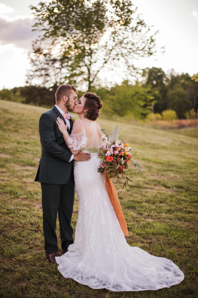Bride and groom kissing, wedding photographer