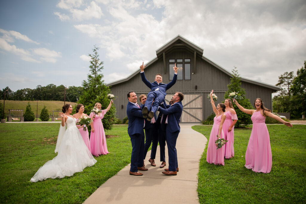 Bridal party celebrating and cheering at their wedding venue